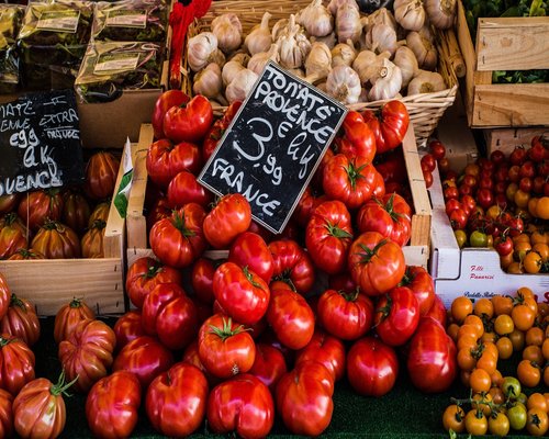 Fresh local vegetables and fruits at a vibrant market stall