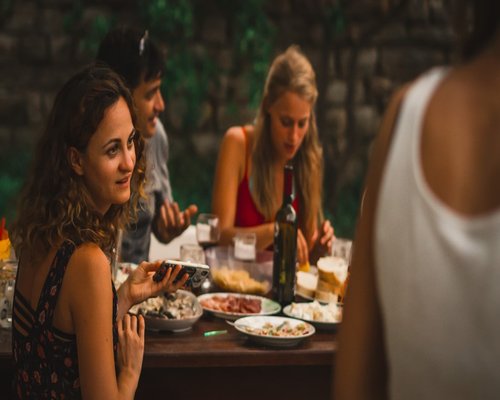 Group of people enjoying a relaxed outdoor dinner